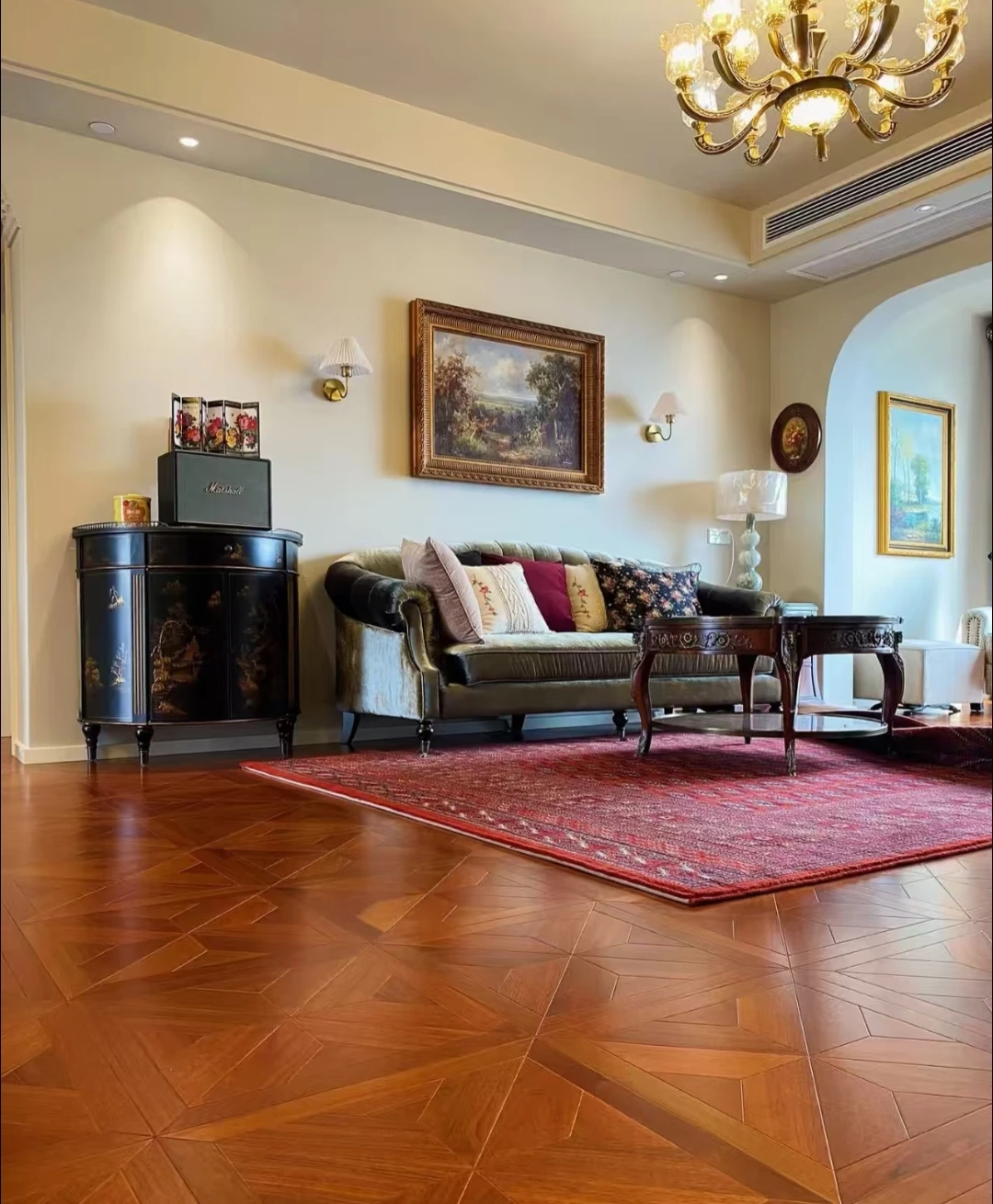 Warm brown geometric parquet flooring in a classic living room