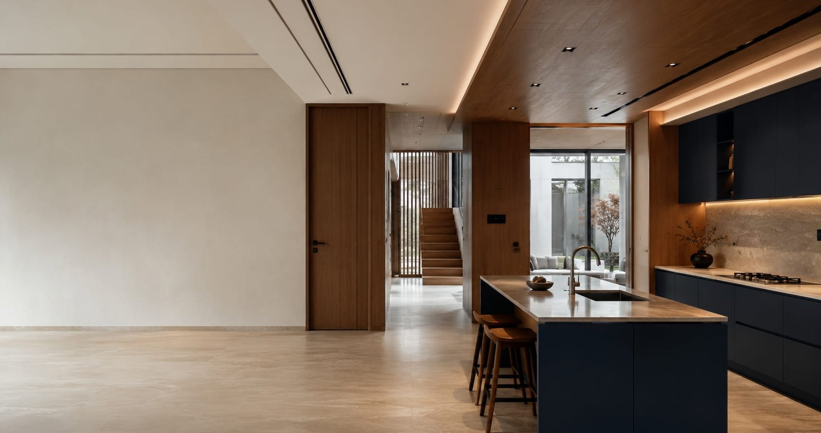 Coordinated kitchen, doors, windows, wall finishes and stair elements in a contemporary interior