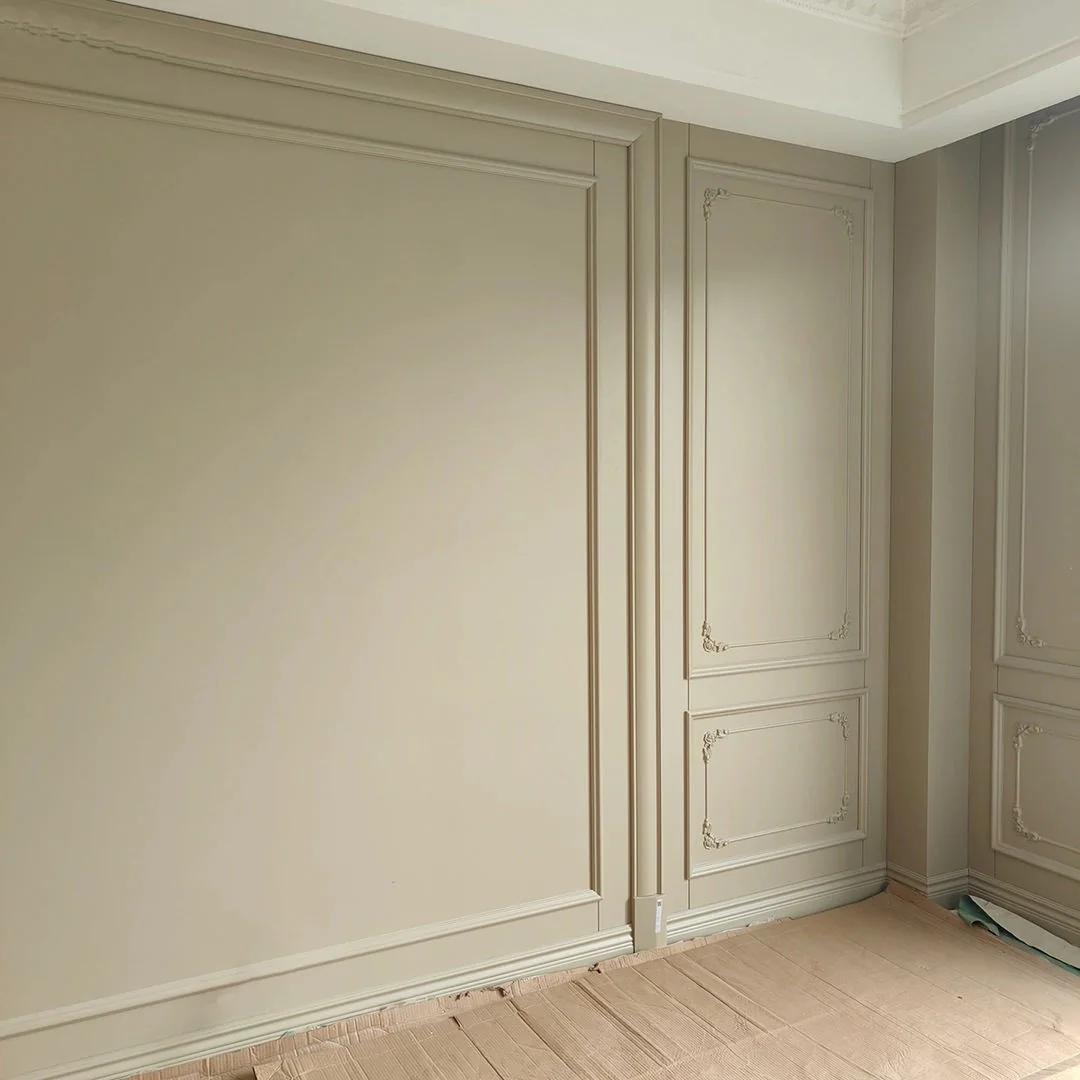 Decorative wall panels and moulding in a neutral interior