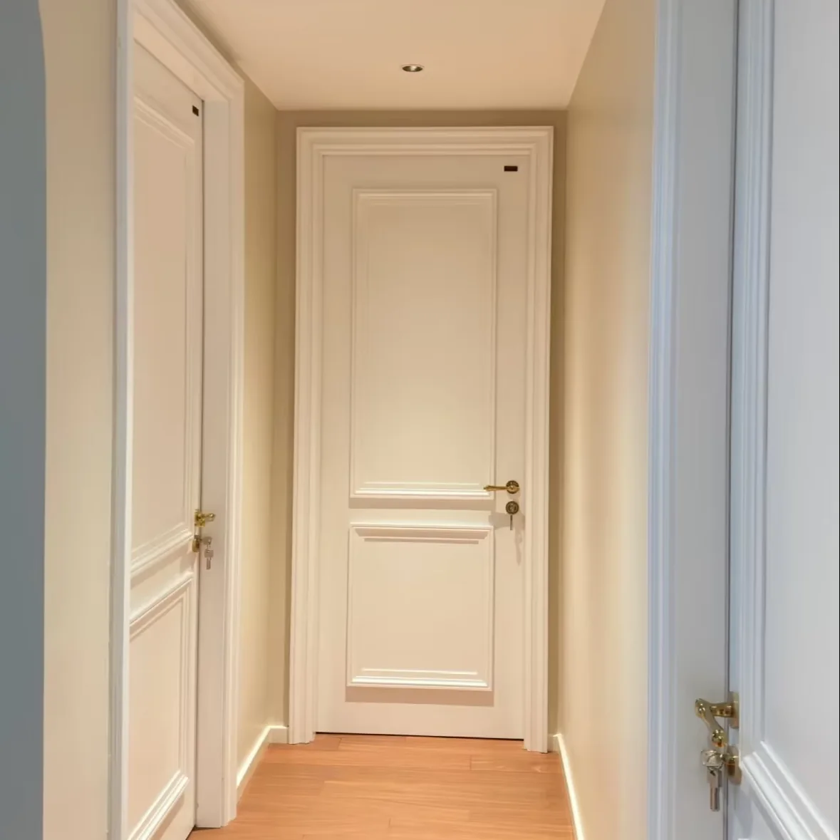 White composite interior door model CD-14 installed in a corridor