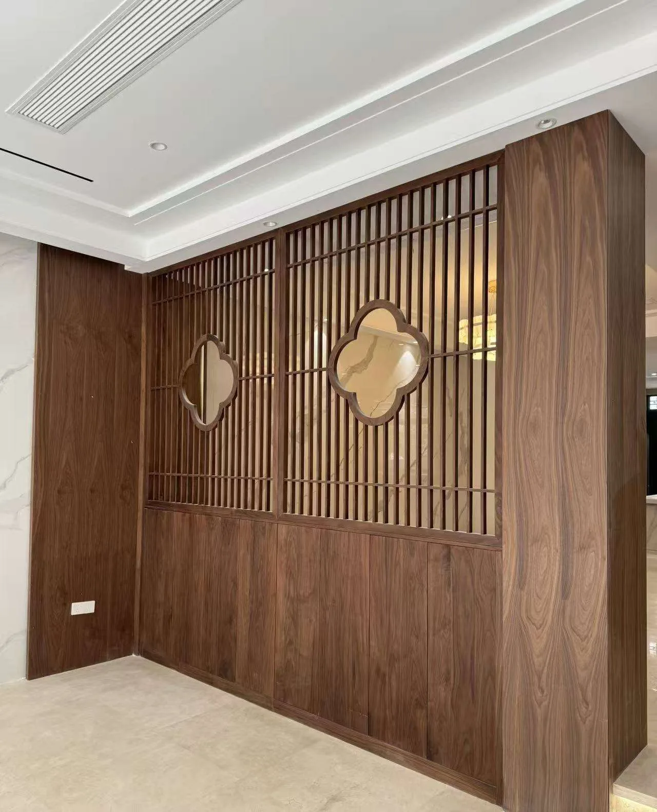 Wood lattice partition with framed openings used as a spatial design reference