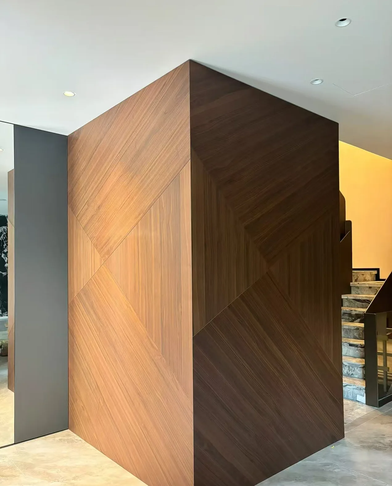 Geometric wood wall panel direction used as an interior design reference