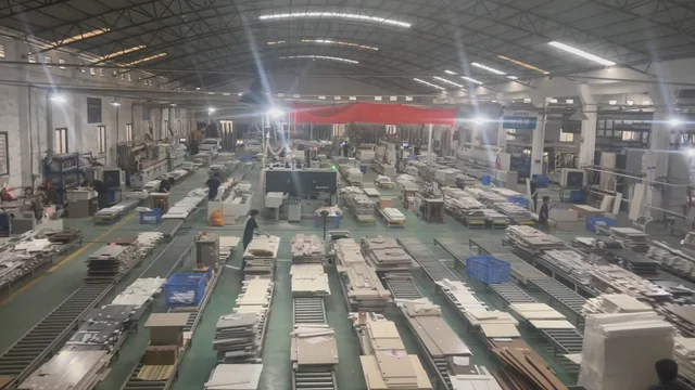Workshop interior with rows of panel stacks and roller tables
